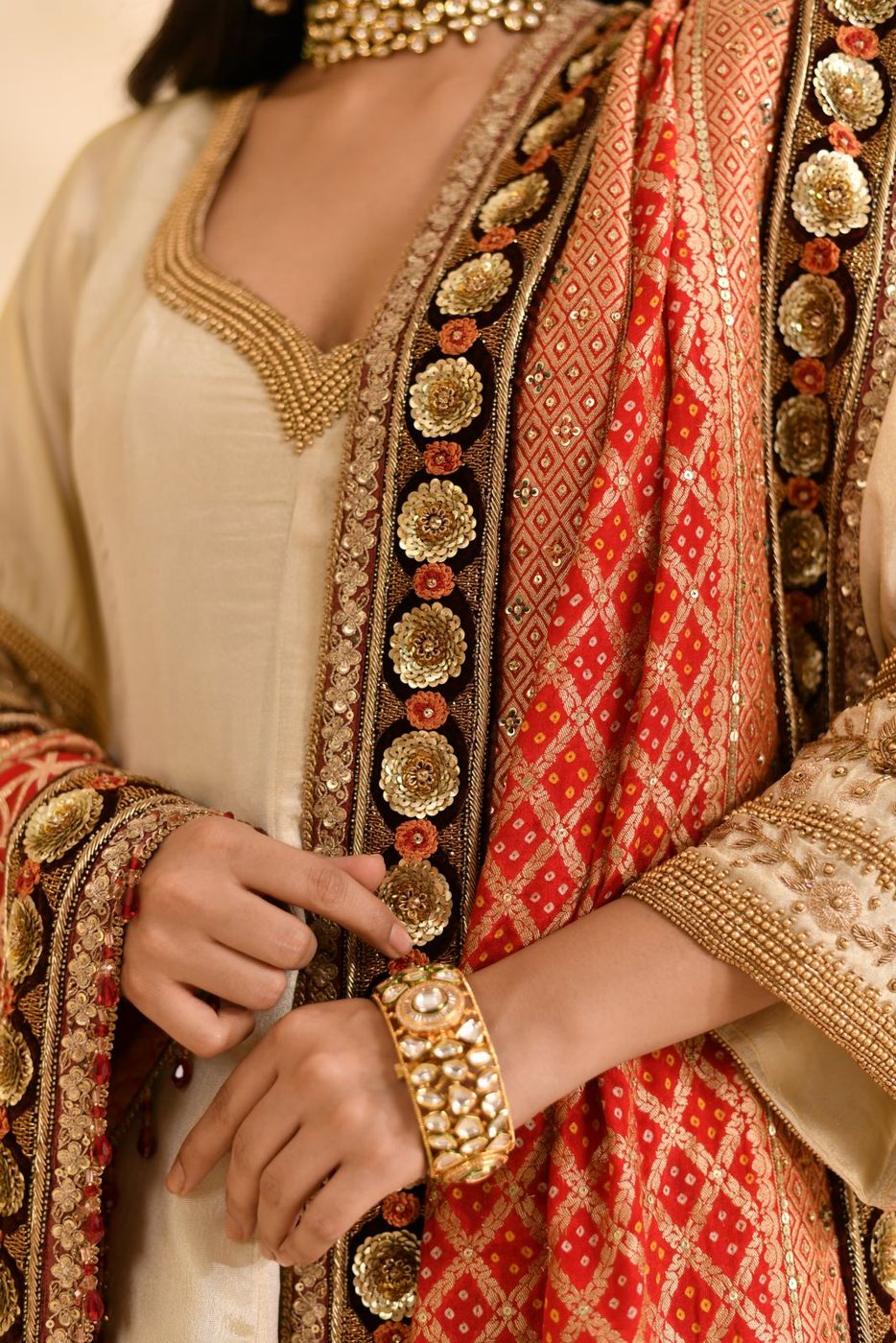 Hand-embroidered border detail with kundan bangle